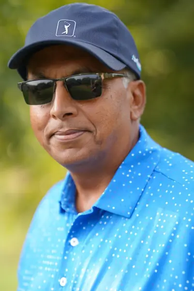 Close-up portrait of a Tigers player in cap and sunglasses